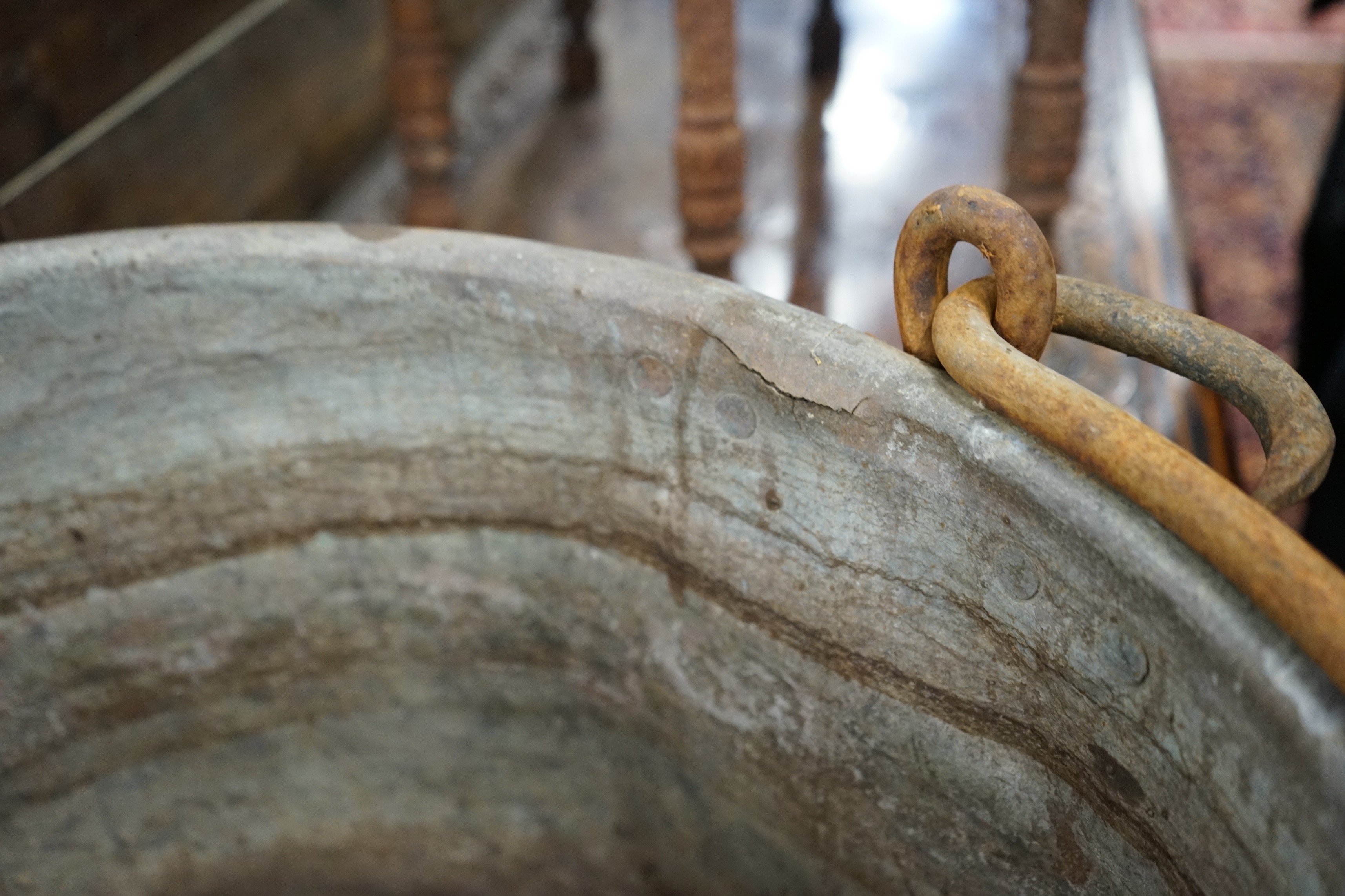 A Victorian brass and wrought iron cauldron with wrought iron swing handle, diameter 56cm, height 35cm
